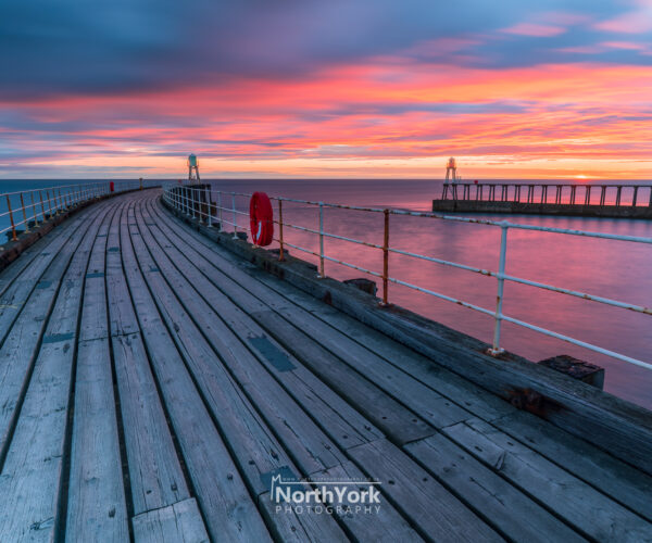 Fiery Sunrise at Whitby Pier, North York Moors
