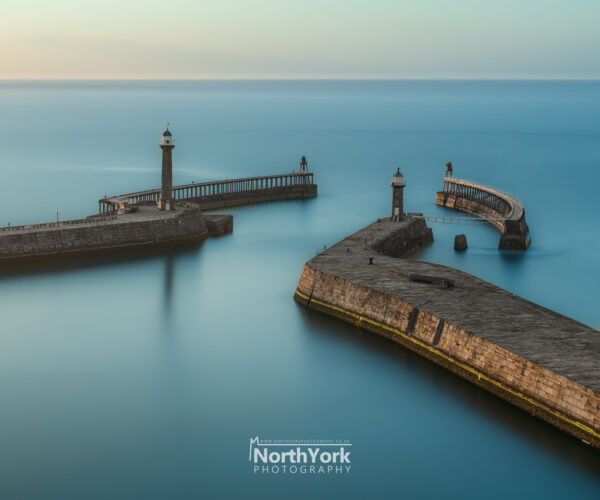 calm waters at whitby pier north yorkshire